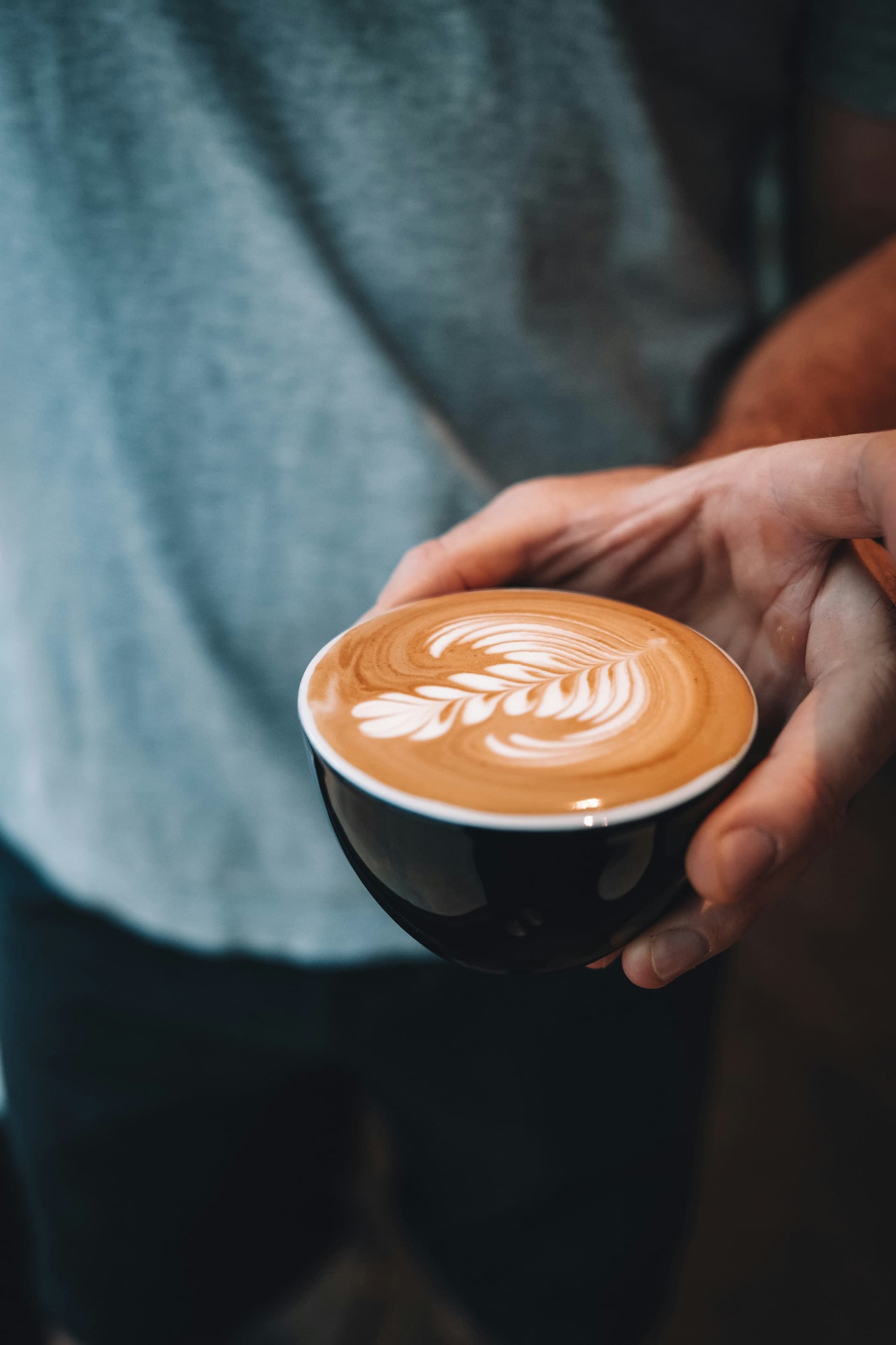Professional barista preparing espresso in a modern café